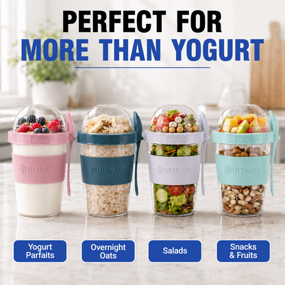 Four portable Yogurt Parfait Cups from Ultimate Brand lined up on a kitchen counter, filled with yogurt, overnight oats, salads, and snacks. The cups have pink, teal, white, and mint green silicone sleeves with clear lids and side handles.